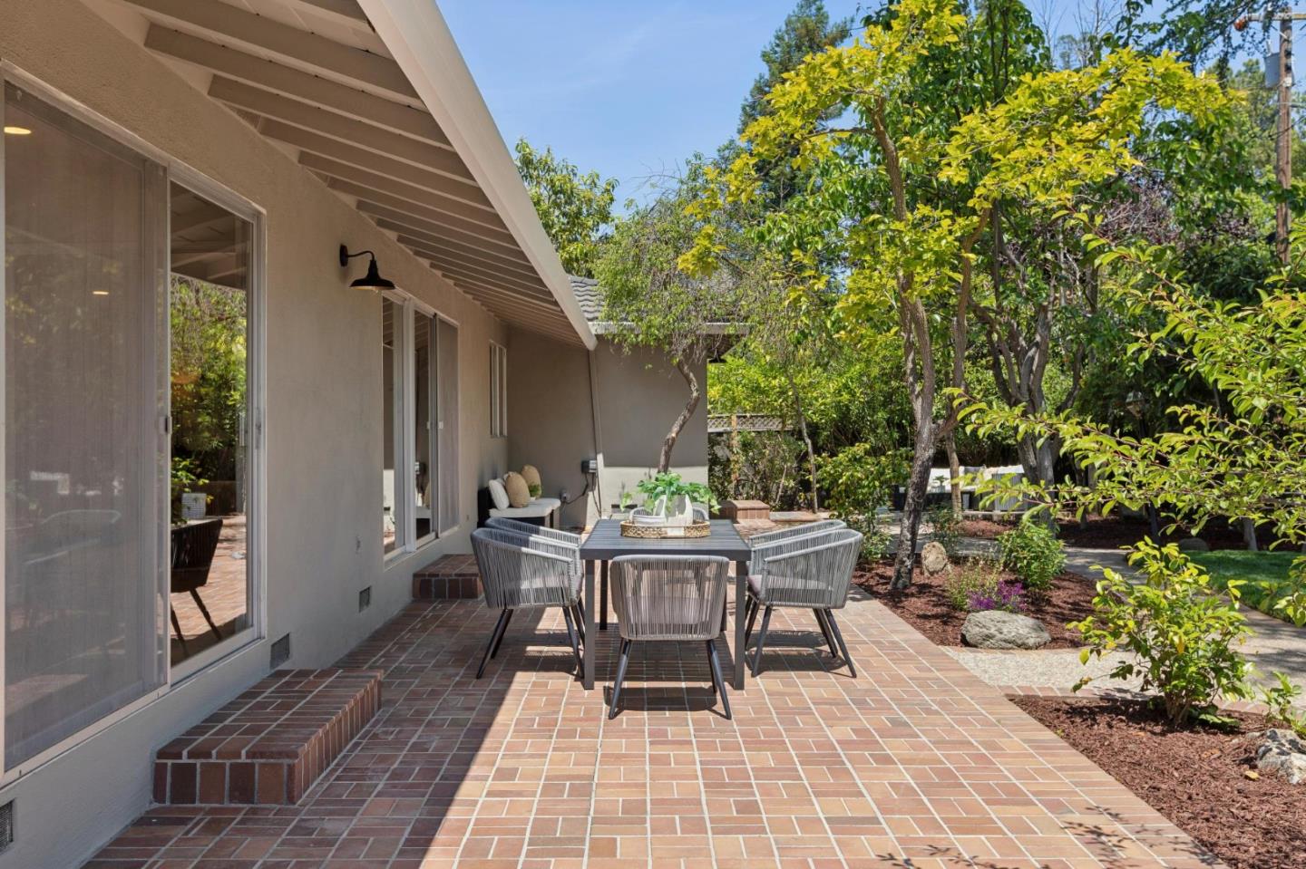 755 Santa Rita Avenue Los Altos, CA 94022 - Photo 39 of 50 a view of a patio with table and chairs and potted plants