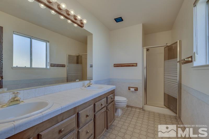 1670 Alamo Street Reno, NV 89503 - Photo 14 of 25 a bathroom with a sink a toilet and shower