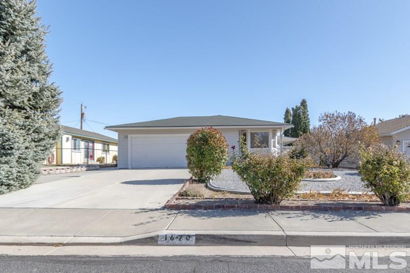 1670 Alamo Street Reno, NV 89503 - Photo 3 of 25 a front view of a house with garden