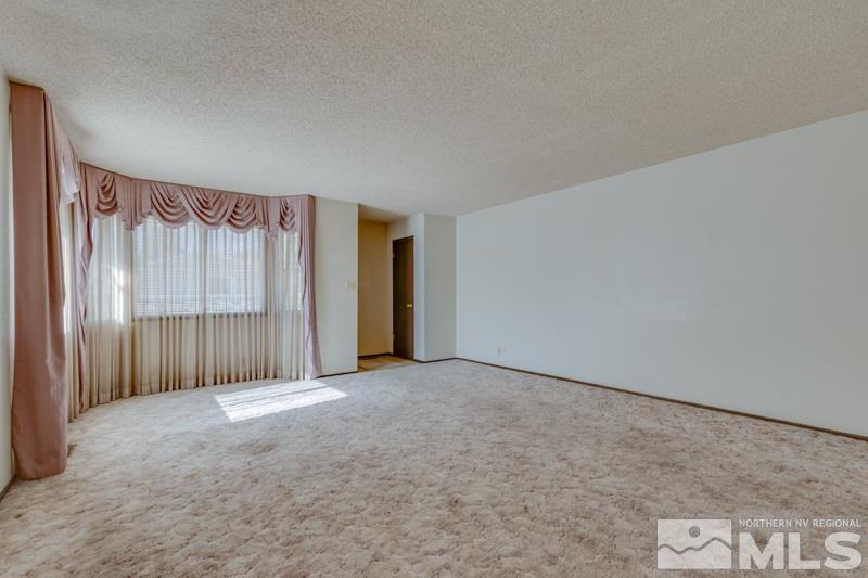 1670 Alamo Street Reno, NV 89503 - Photo 6 of 25 a view of an empty room with a window