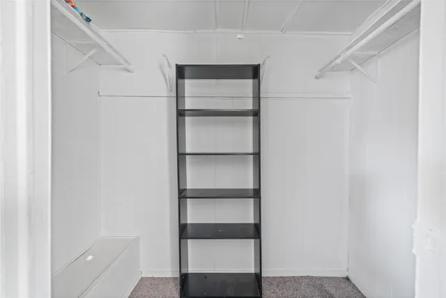 a view of an empty walk in closet