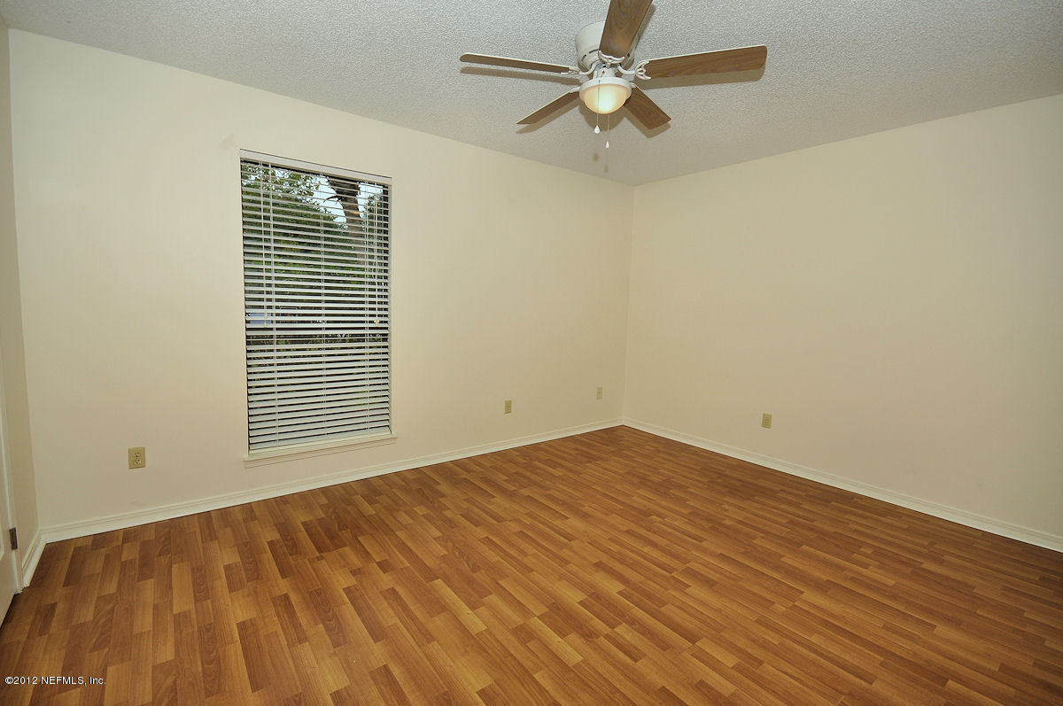 1521 Derringer Road Jacksonville, FL 32225 - Photo 12 of 20 a view of an empty room with a window