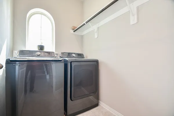 a utility room with washer and dryer