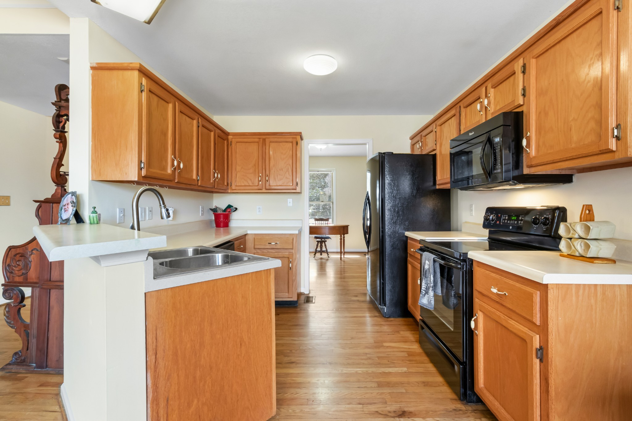 3710 Marthas Chapel Road Cunningham, TN 37052 - Photo 10 of 50 a kitchen with stainless steel appliances granite countertop a sink stove refrigerator and cabinets