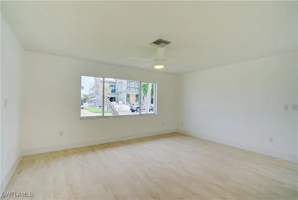 a view of an empty room with a window
