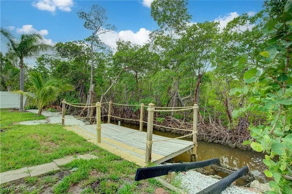 a view of house with backyard and entertaining space