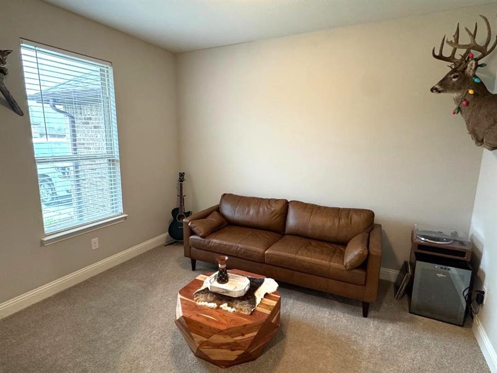 1455 Radecke Road Krum, TX 76249 - Photo 8 of 18 a living room with furniture a air conditioner and a window