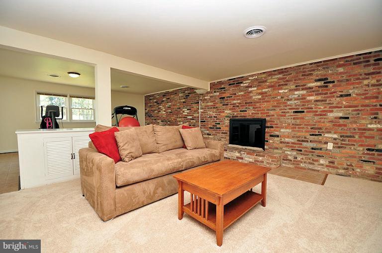 6421 Lochridge Road Columbia, MD 21044 - Photo 2 of 30 Family Room w/woodburning FP and new carpet