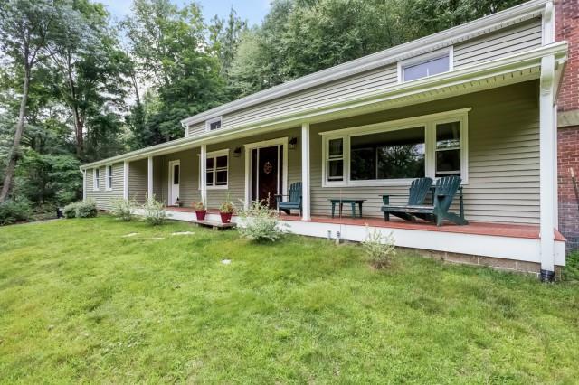 185 Hanover Road Newtown, CT 06470 - Photo 1 of 1 a view of a house with backyard porch and sitting area