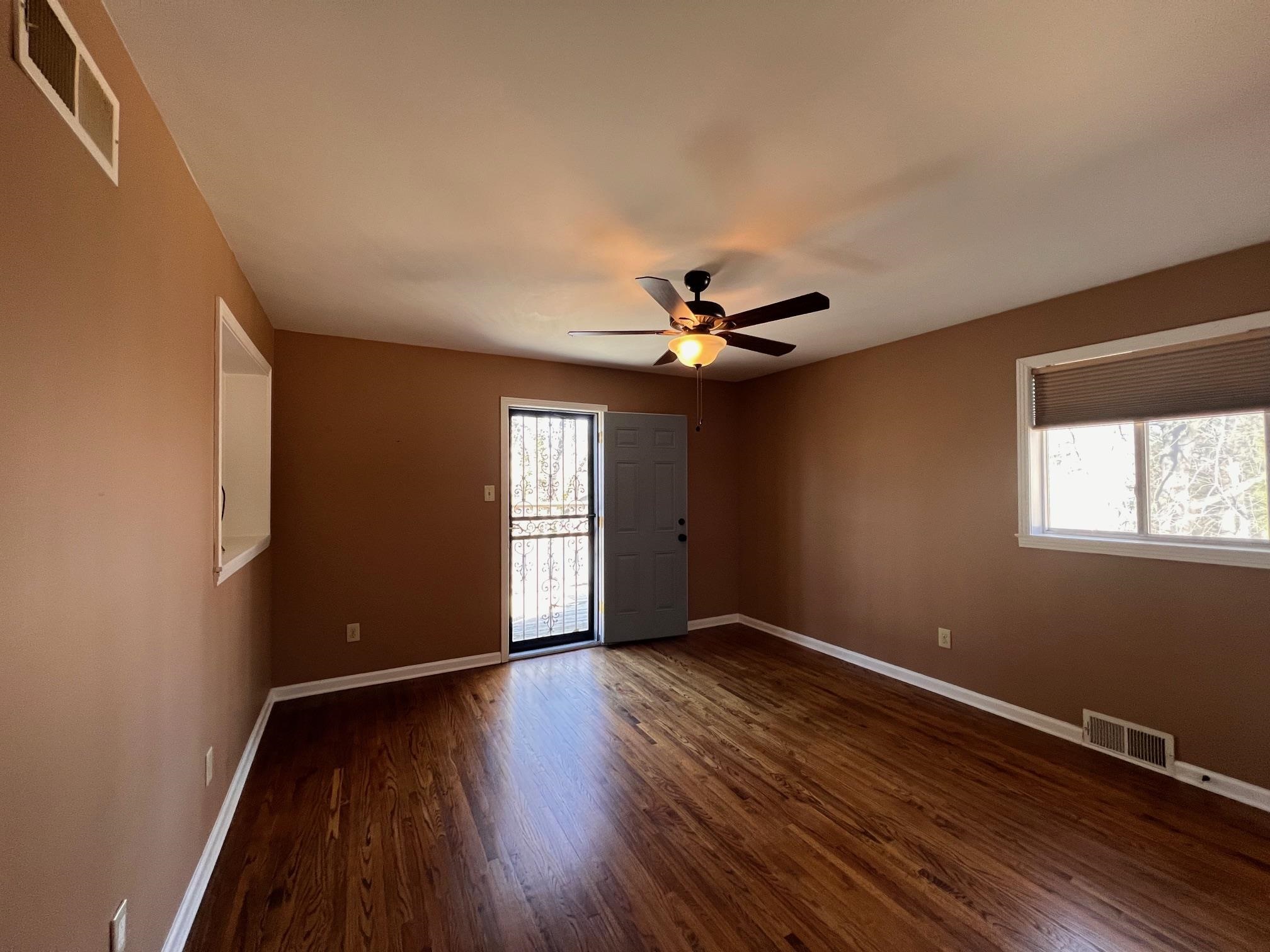3034 Laurencekirk Road Memphis, TN 38128 - Photo 13 of 27 a view of empty room with wooden floor and fan