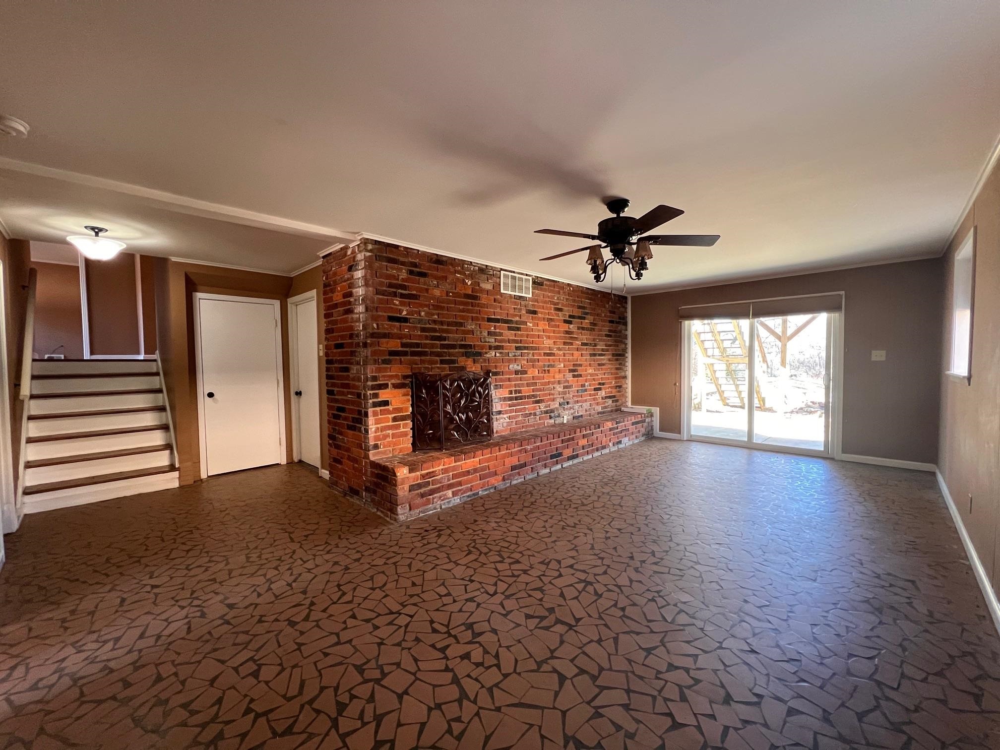 3034 Laurencekirk Road Memphis, TN 38128 - Photo 18 of 27 a view of a livingroom with a fireplace and window