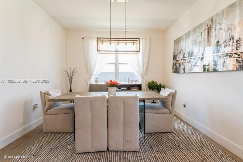 16033 Southwest 277th Street Homestead, FL 33031 - Photo 13 of 37 a living room with furniture and a window