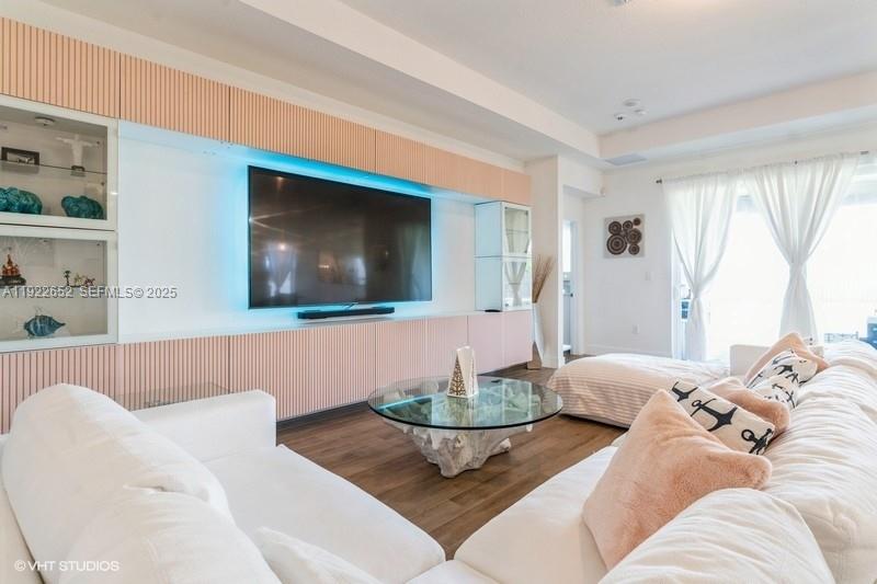 16033 Southwest 277th Street Homestead, FL 33031 - Photo 15 of 37 a living room with furniture and a flat screen tv