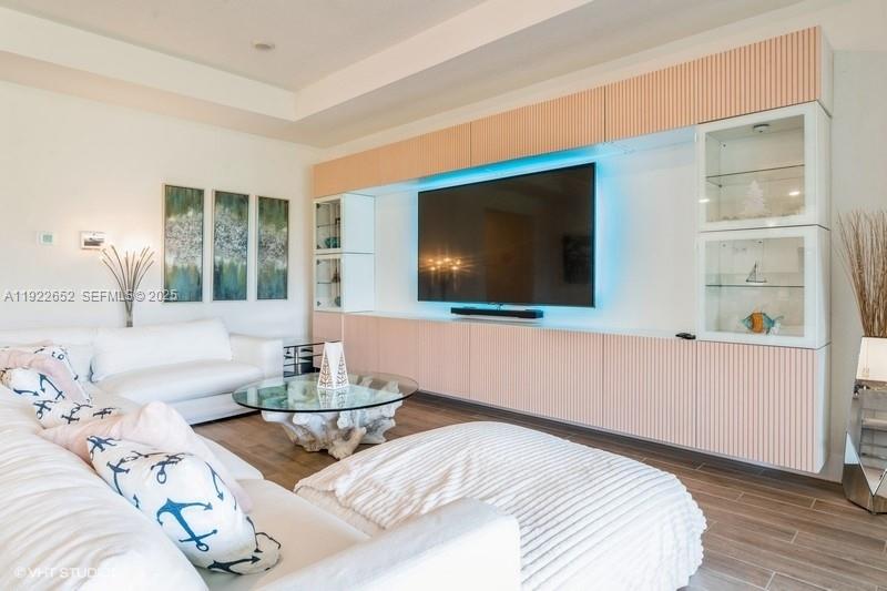 16033 Southwest 277th Street Homestead, FL 33031 - Photo 16 of 37 a bedroom with a bed and flat screen tv