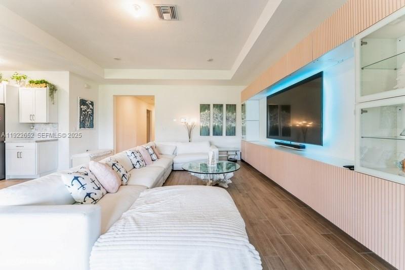 16033 Southwest 277th Street Homestead, FL 33031 - Photo 19 of 37 a living room with furniture and a flat screen tv