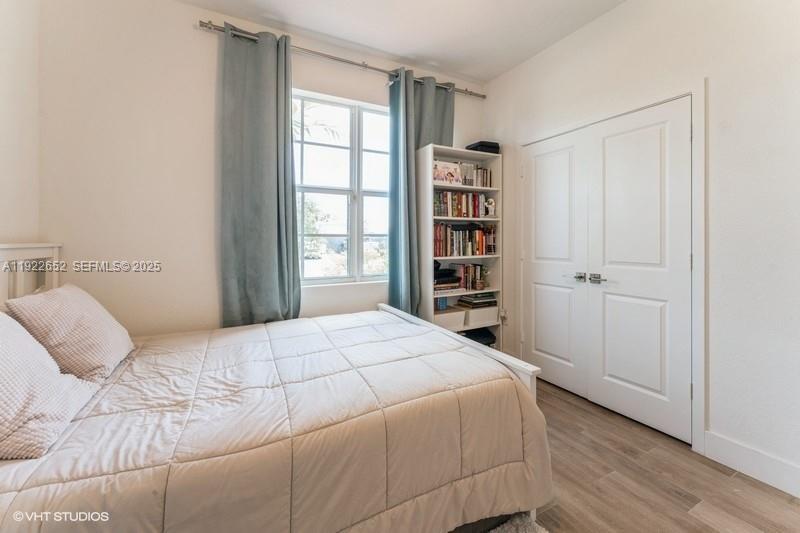 16033 Southwest 277th Street Homestead, FL 33031 - Photo 21 of 37 a bedroom with a bed and a window