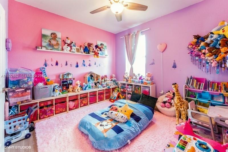 16033 Southwest 277th Street Homestead, FL 33031 - Photo 23 of 37 a bed room with lots of baby toys