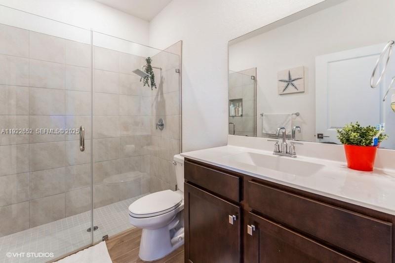16033 Southwest 277th Street Homestead, FL 33031 - Photo 31 of 37 a bathroom with a sink a toilet and shower