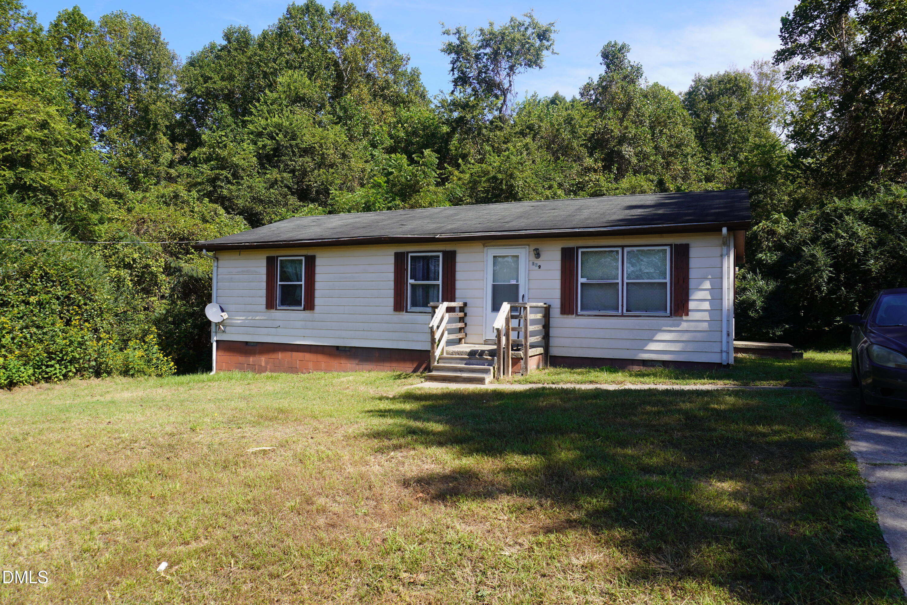 179 Lynnbank Estates Road Kittrell, NC 27544 - Photo 1 of 16 a view of a backyard with table and chairs and plants
