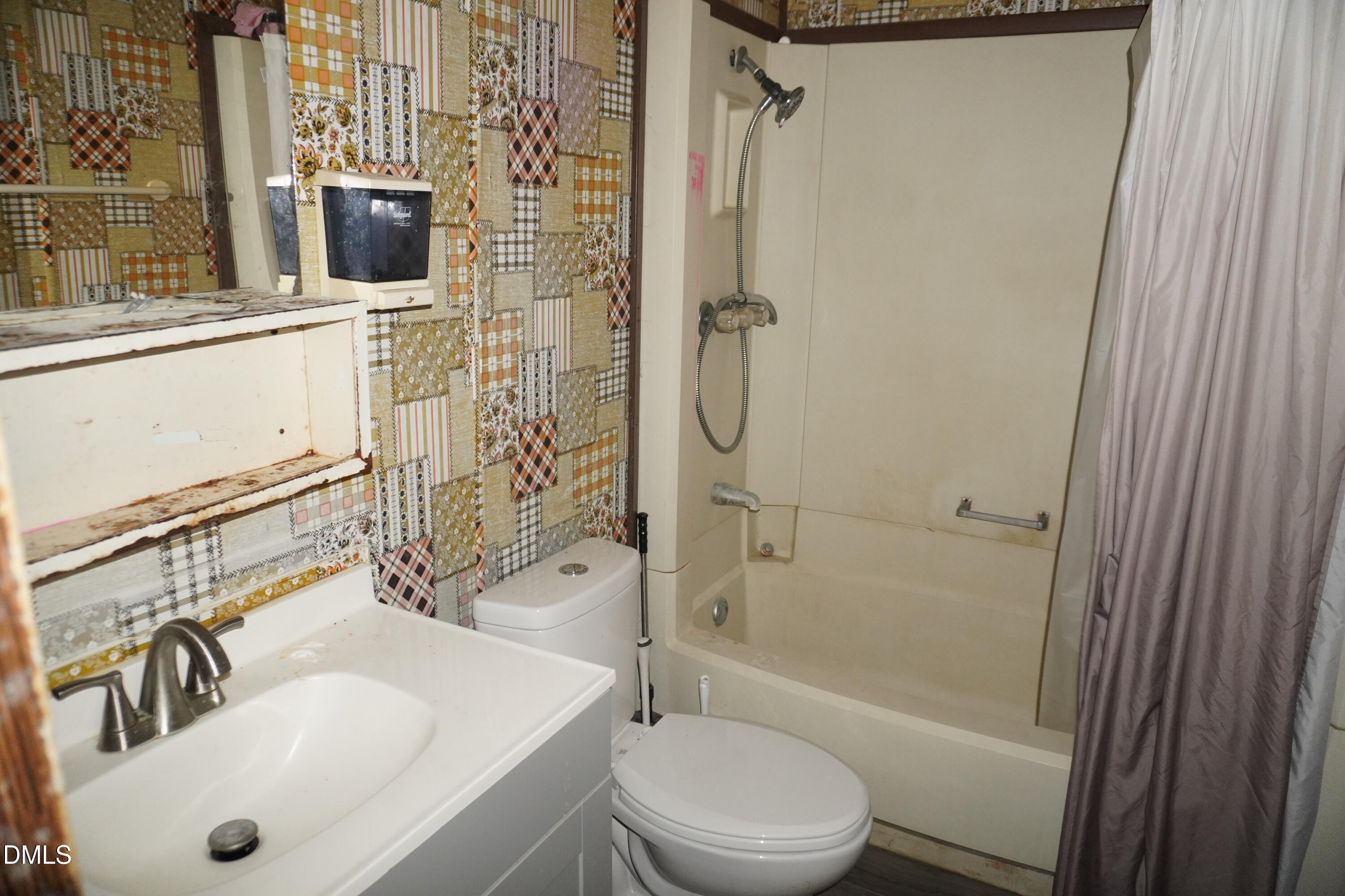 179 Lynnbank Estates Road Kittrell, NC 27544 - Photo 10 of 16 a bathroom with a sink toilet and shower