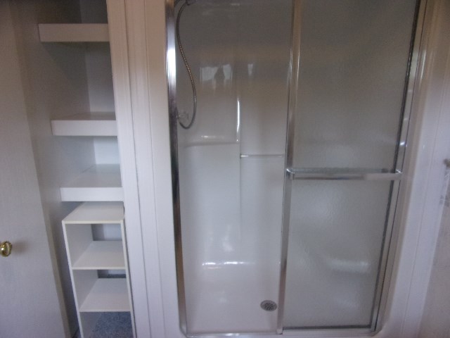 334 Madison Street Sligo, PA 16255 - Photo 13 of 24 a bathroom with a glass shower door