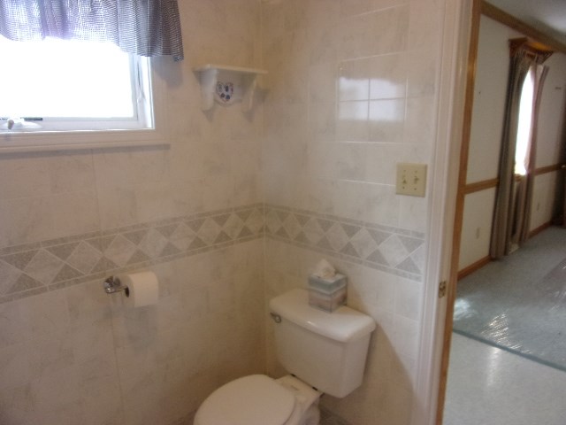 334 Madison Street Sligo, PA 16255 - Photo 14 of 24 a bathroom with a toilet sink and tub