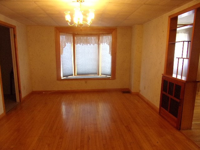 334 Madison Street Sligo, PA 16255 - Photo 16 of 24 an empty room with wooden floor and windows