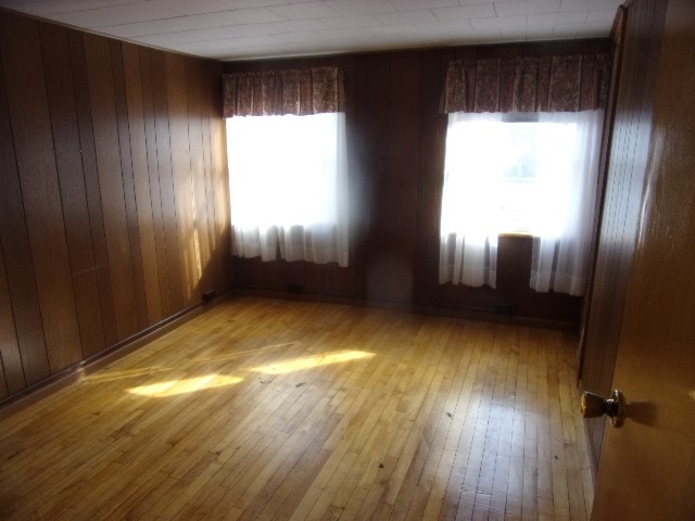 334 Madison Street Sligo, PA 16255 - Photo 20 of 24 wooden floor in an empty room with a window
