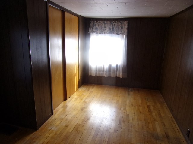334 Madison Street Sligo, PA 16255 - Photo 22 of 24 wooden floor in an empty room with a window