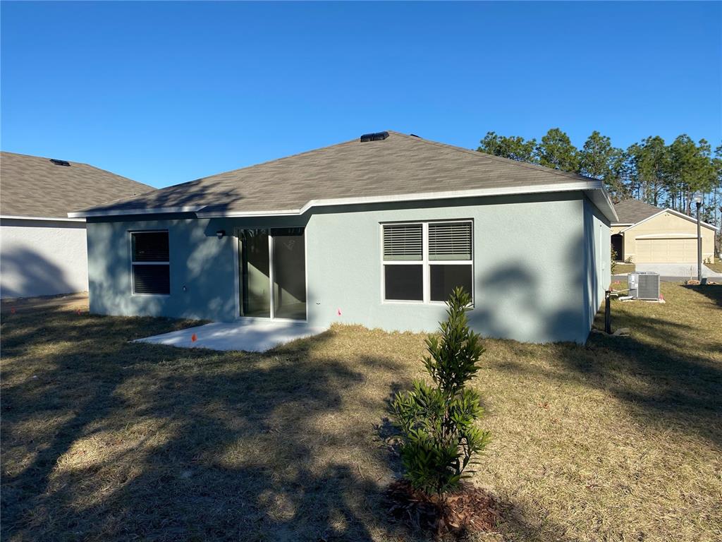 308 Hickory Course Radiel Ocala, FL 34472 - Photo 23 of 24 a view of a house with a yard
