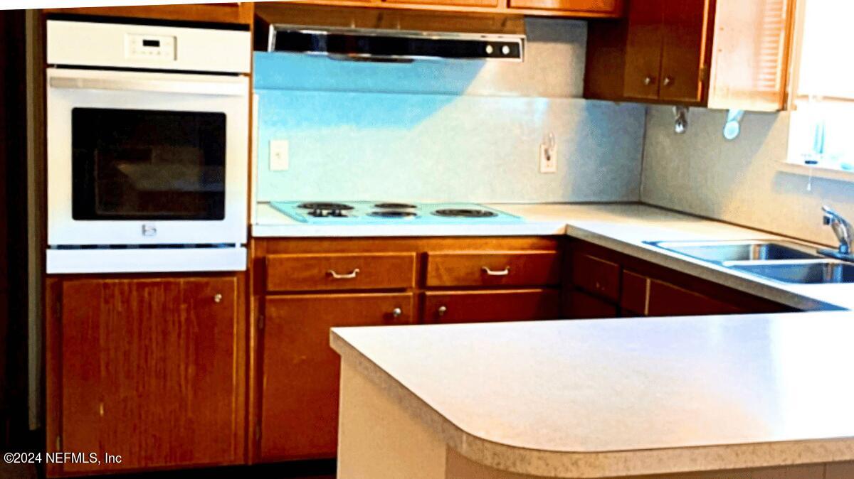 1640 Seminary Street Jacksonville, FL 32209 - Photo 10 of 16 a kitchen with a sink and a stove