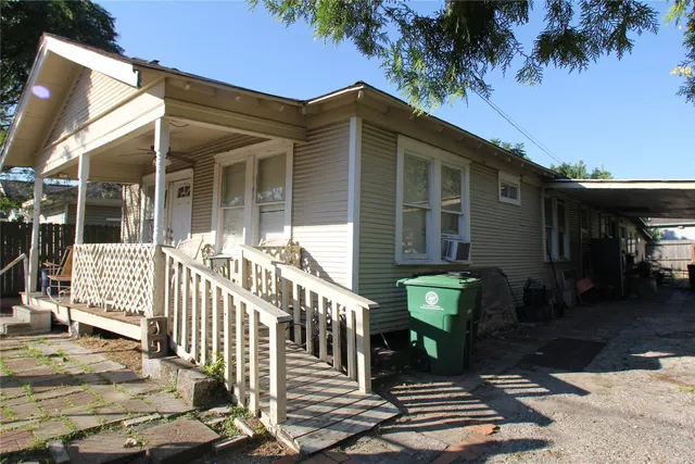 a view of a chair and table of the house