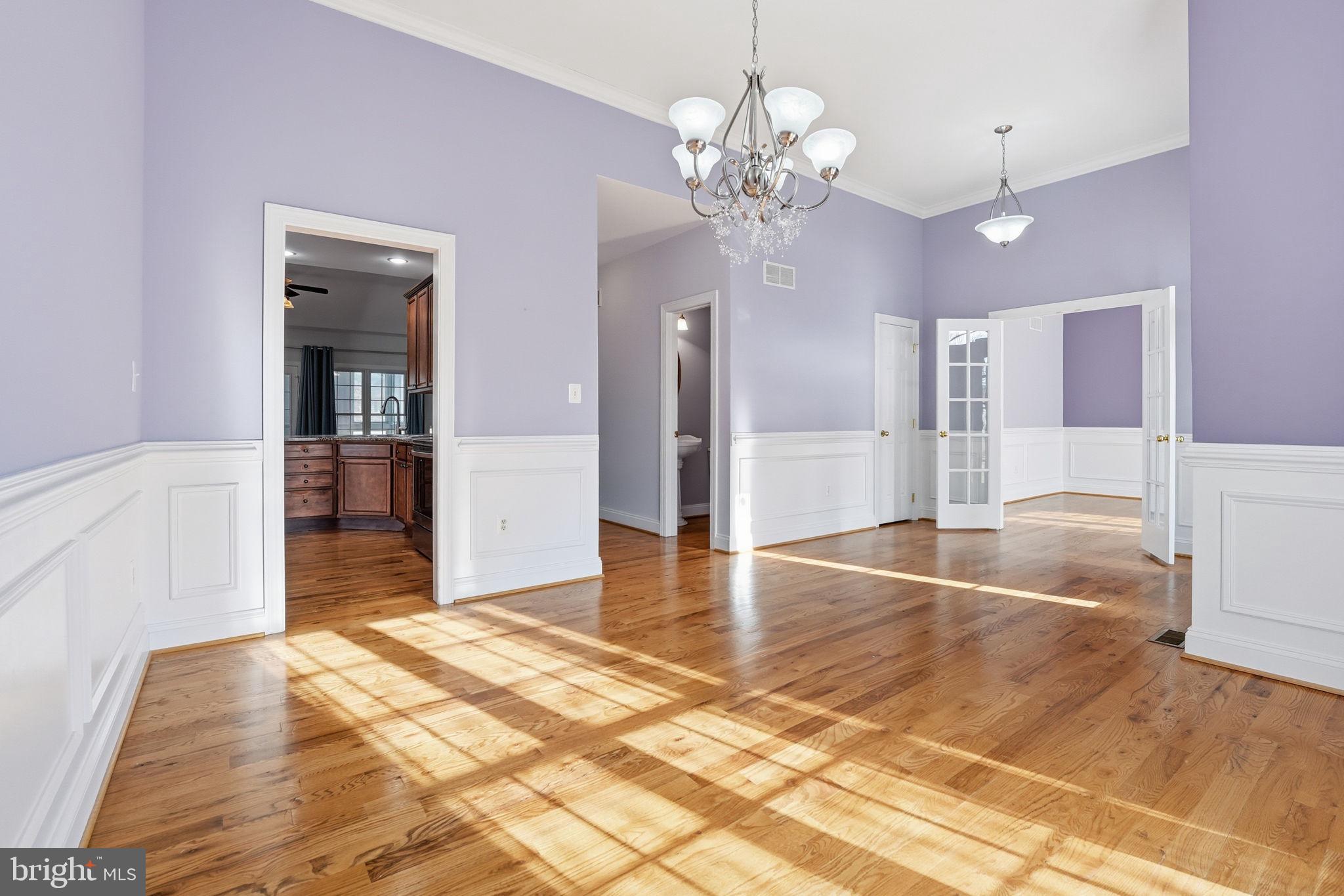 450 Canyon Road Winchester, VA 22602 - Photo 15 of 51 a view of a hallway with wooden floor and chandelier