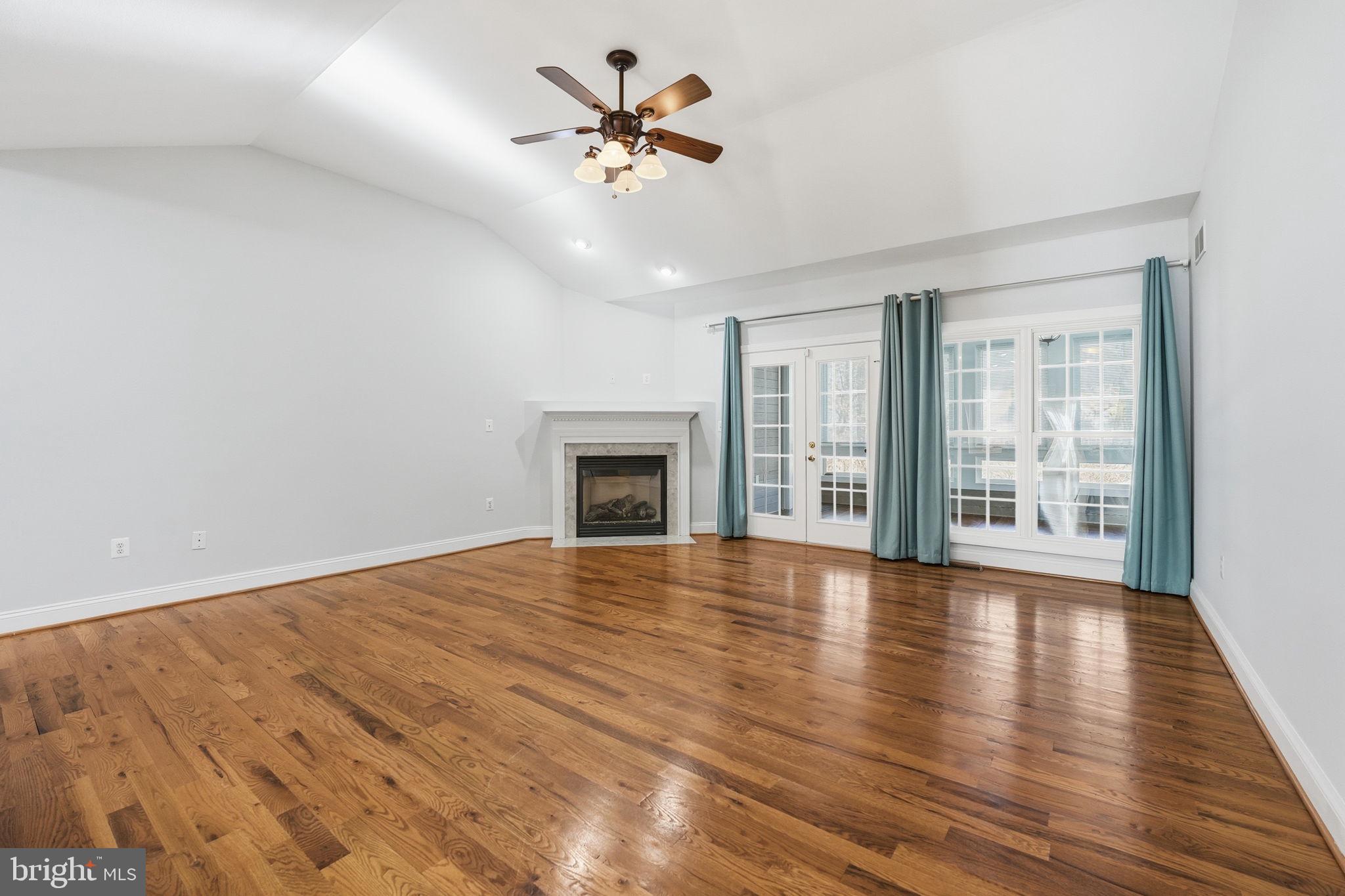 450 Canyon Road Winchester, VA 22602 - Photo 17 of 51 a view of an empty room with wooden floor and a window