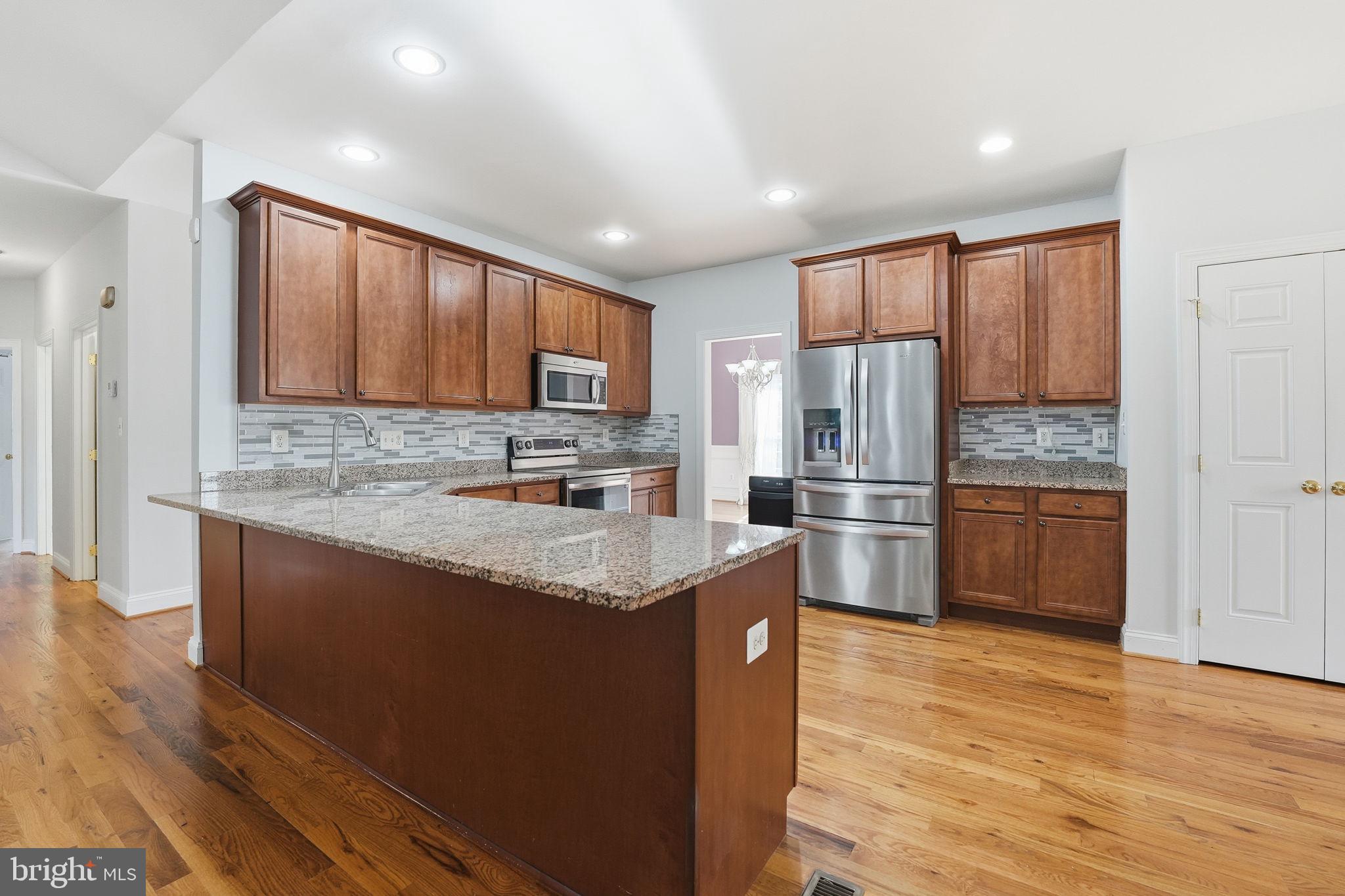 450 Canyon Road Winchester, VA 22602 - Photo 20 of 51 a kitchen with stainless steel appliances granite countertop a refrigerator stove and oven