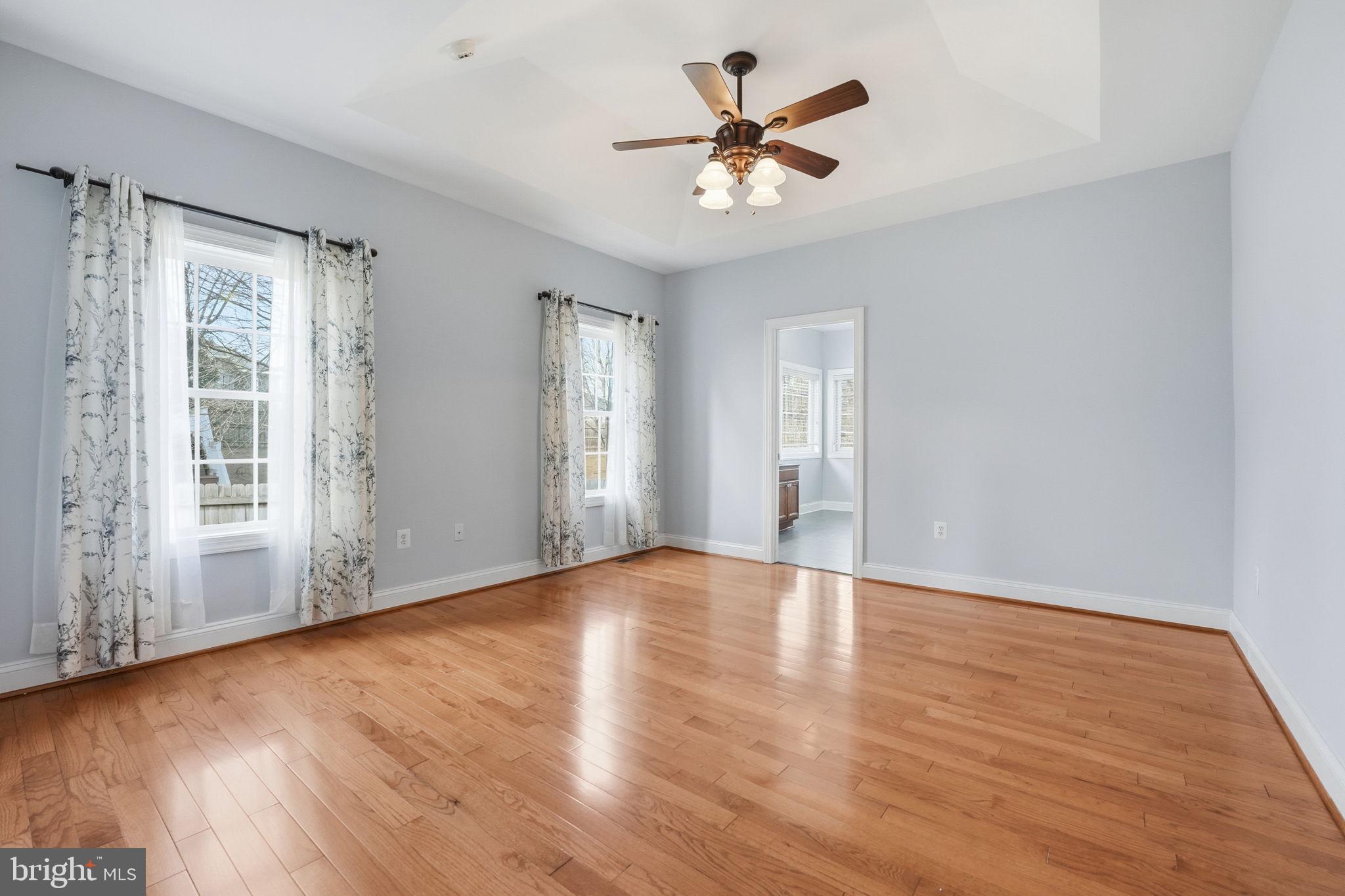 450 Canyon Road Winchester, VA 22602 - Photo 27 of 51 a view of an empty room with wooden floor and a window