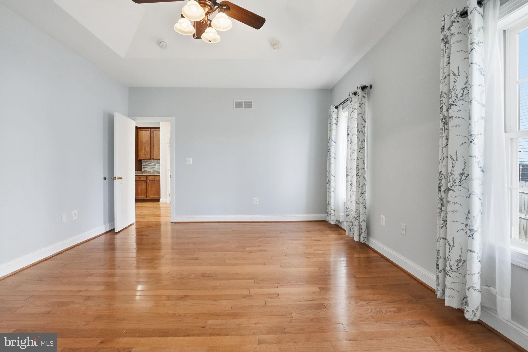 450 Canyon Road Winchester, VA 22602 - Photo 28 of 51 a view of an empty room with wooden floor and a window