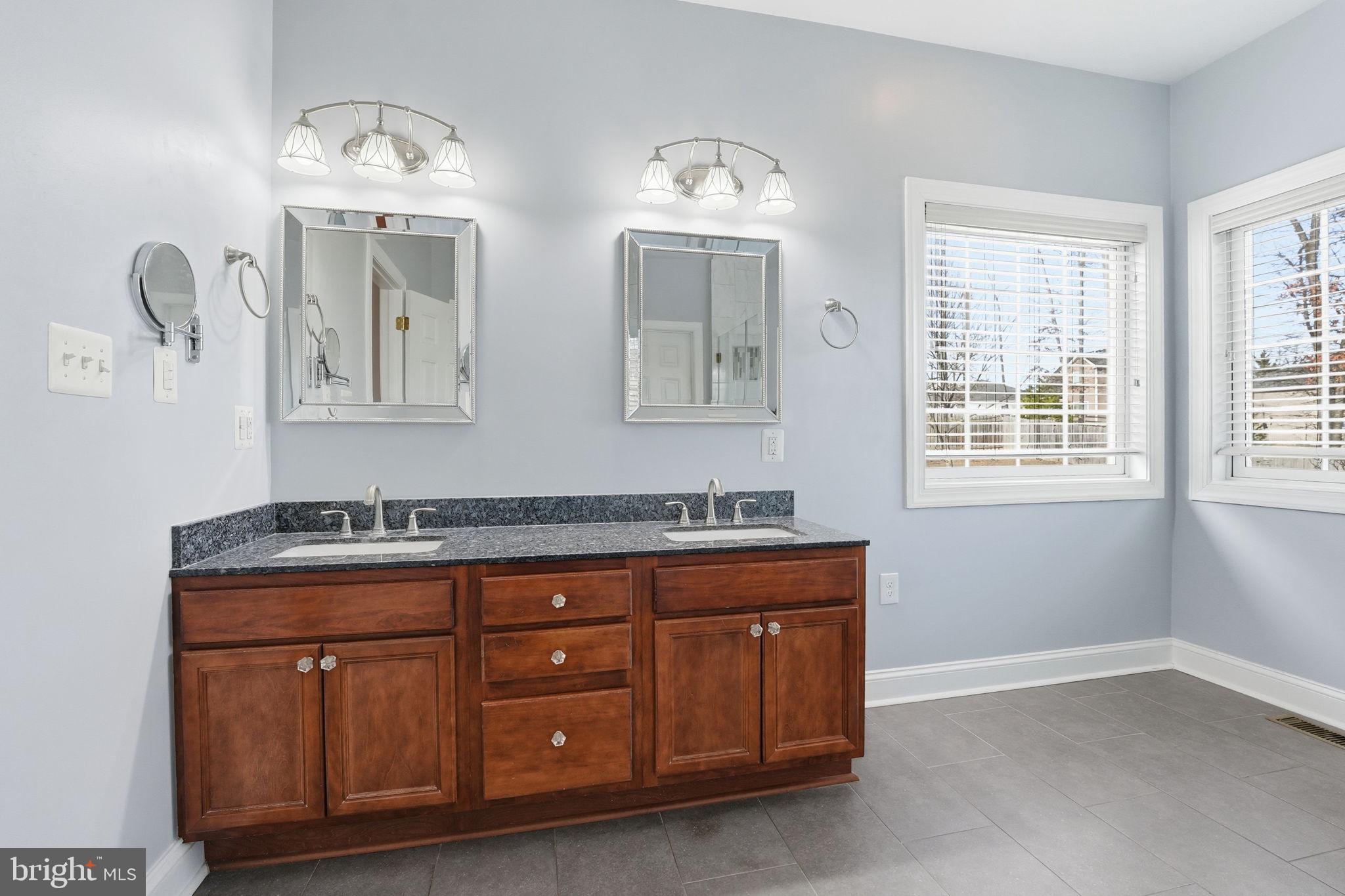 450 Canyon Road Winchester, VA 22602 - Photo 30 of 51 a room with two mirror and window