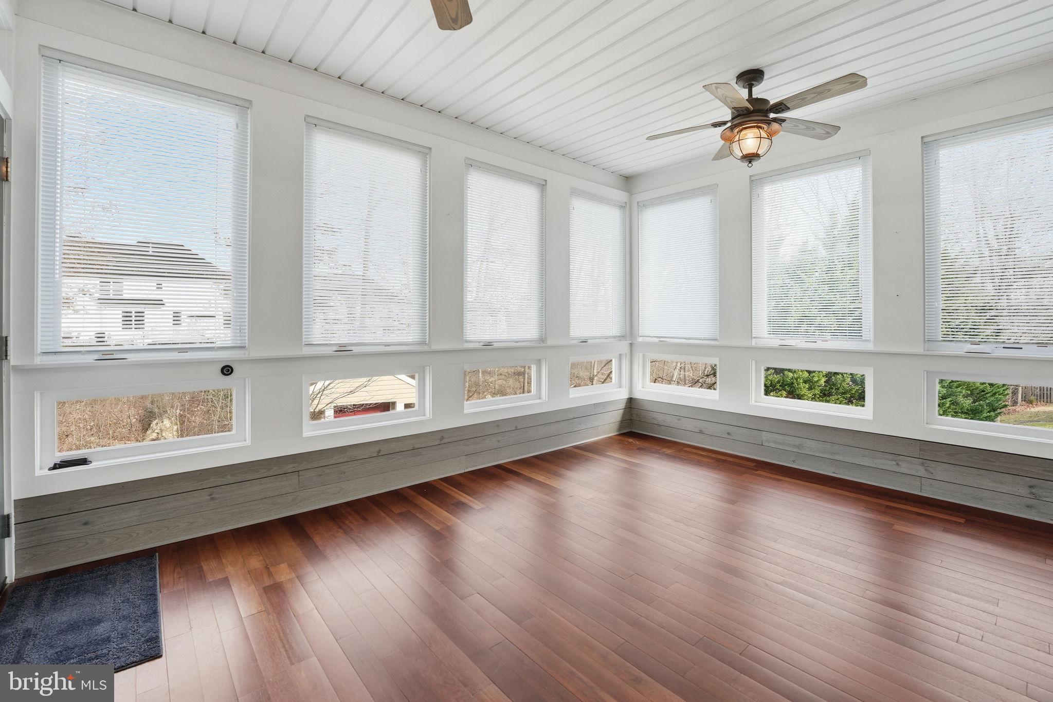 450 Canyon Road Winchester, VA 22602 - Photo 40 of 51 an empty room with wooden floor and windows
