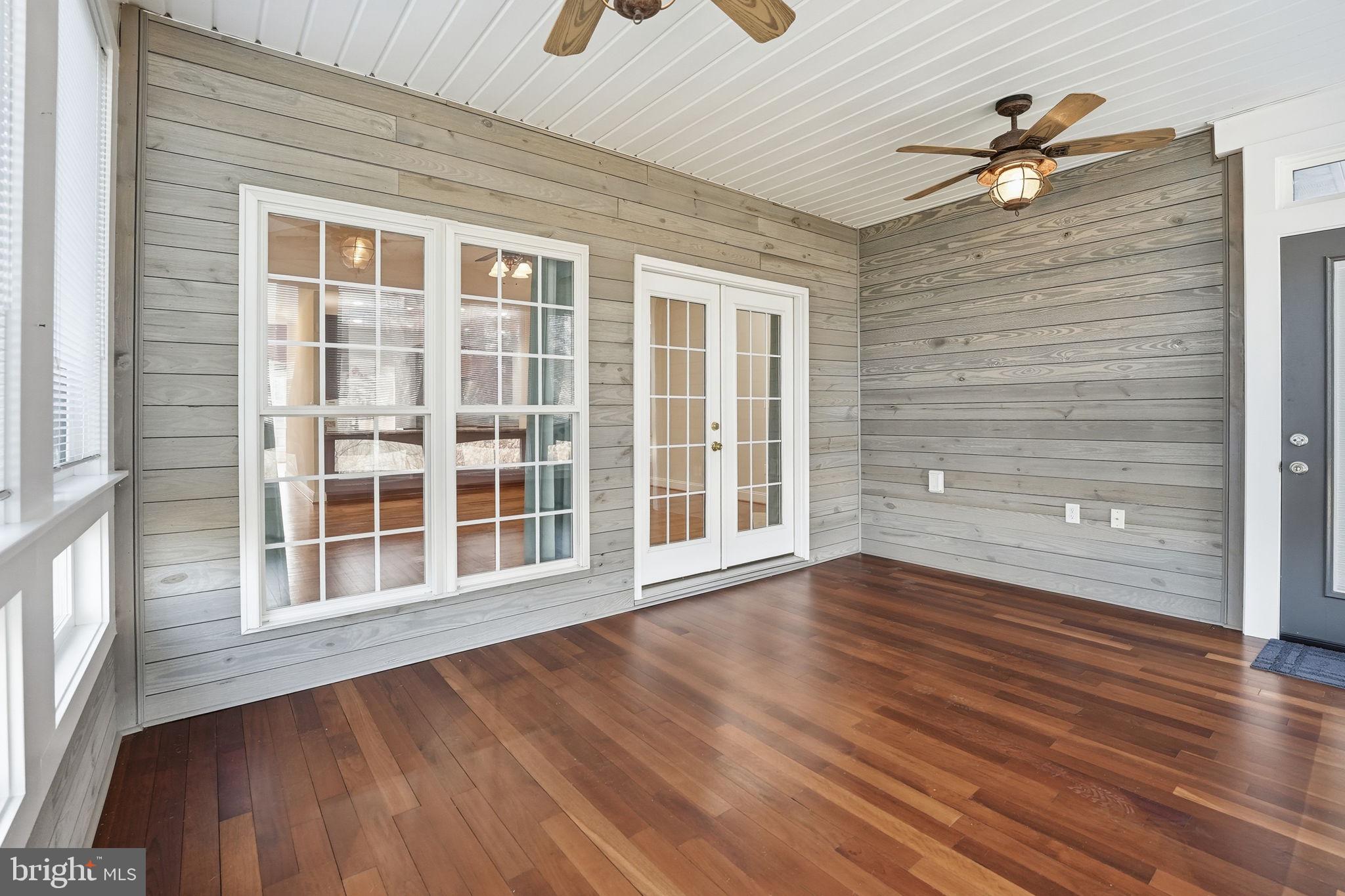 450 Canyon Road Winchester, VA 22602 - Photo 41 of 51 a view of an empty room with wooden floor and a window