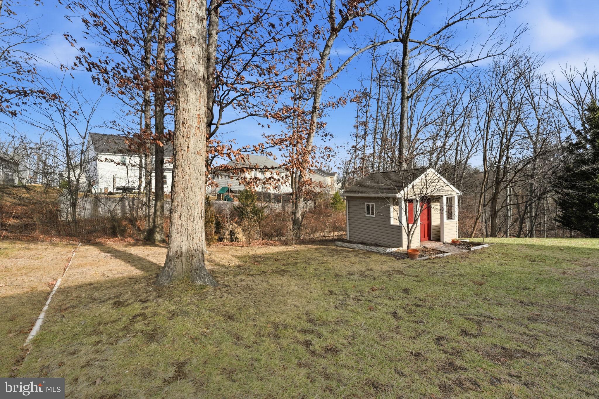 450 Canyon Road Winchester, VA 22602 - Photo 48 of 51 a white house that has a tree in front of it