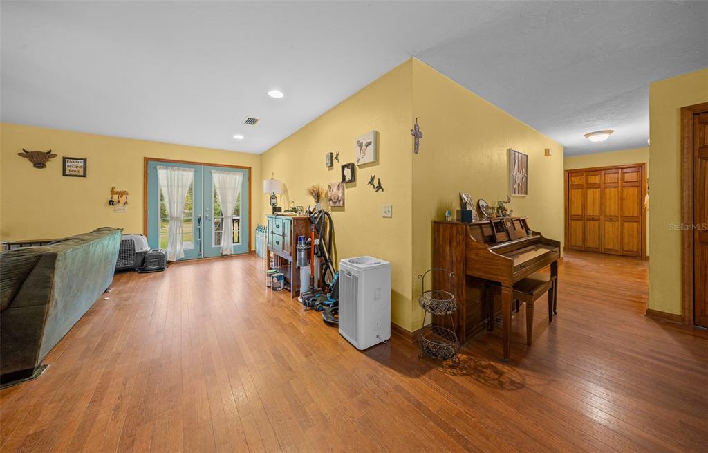 732 Carl Wilson Road Fort White, FL 32038 - Photo 13 of 80 a view of a livingroom with furniture and hardwood floor