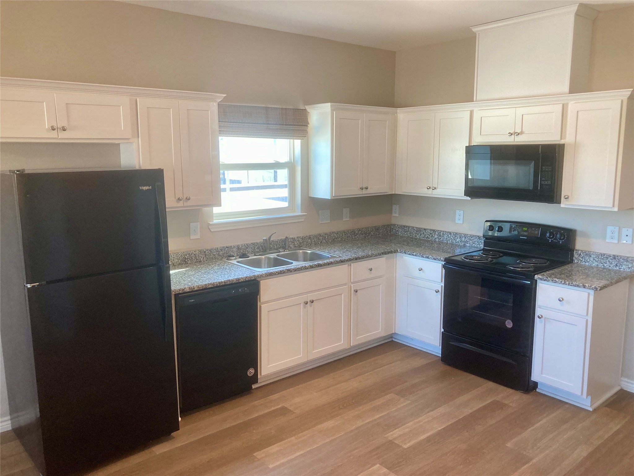 4505 P Galveston, TX 77551 - Photo 5 of 19 a kitchen with a refrigerator stove and microwave