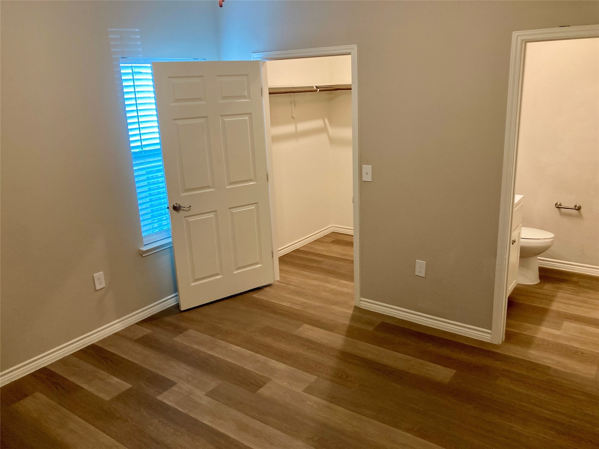 4505 P Galveston, TX 77551 - Photo 8 of 19 a view of an empty room with wooden floor and a window