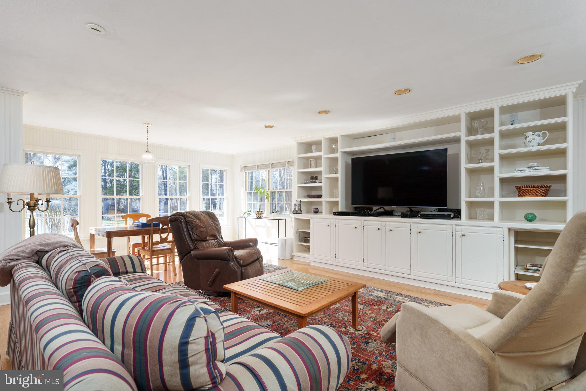 28 Talbot Lane Princeton, NJ 08540 - Photo 16 of 55 a living room with furniture a flat screen tv and a large window