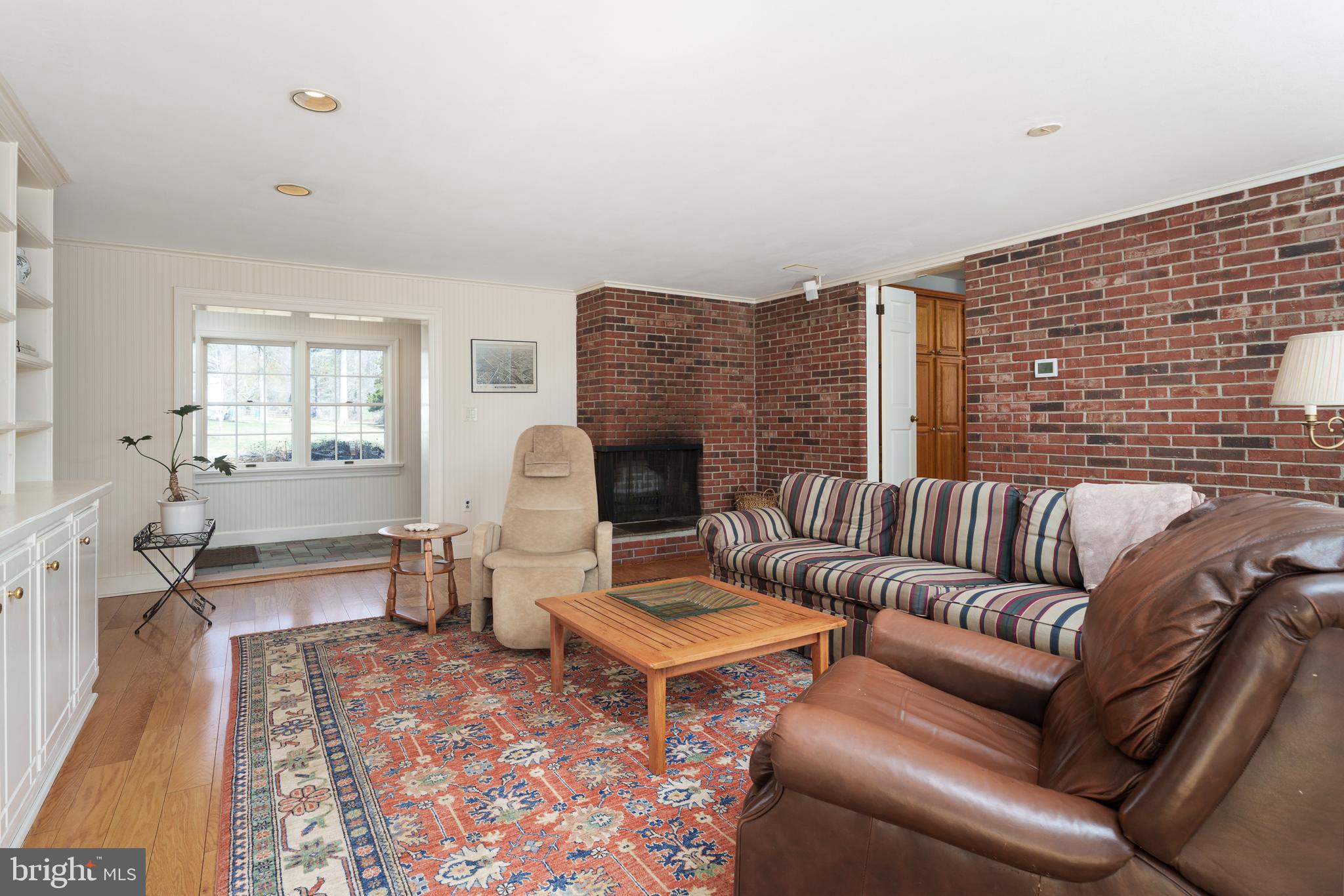 28 Talbot Lane Princeton, NJ 08540 - Photo 19 of 55 a living room with furniture a fireplace and a table