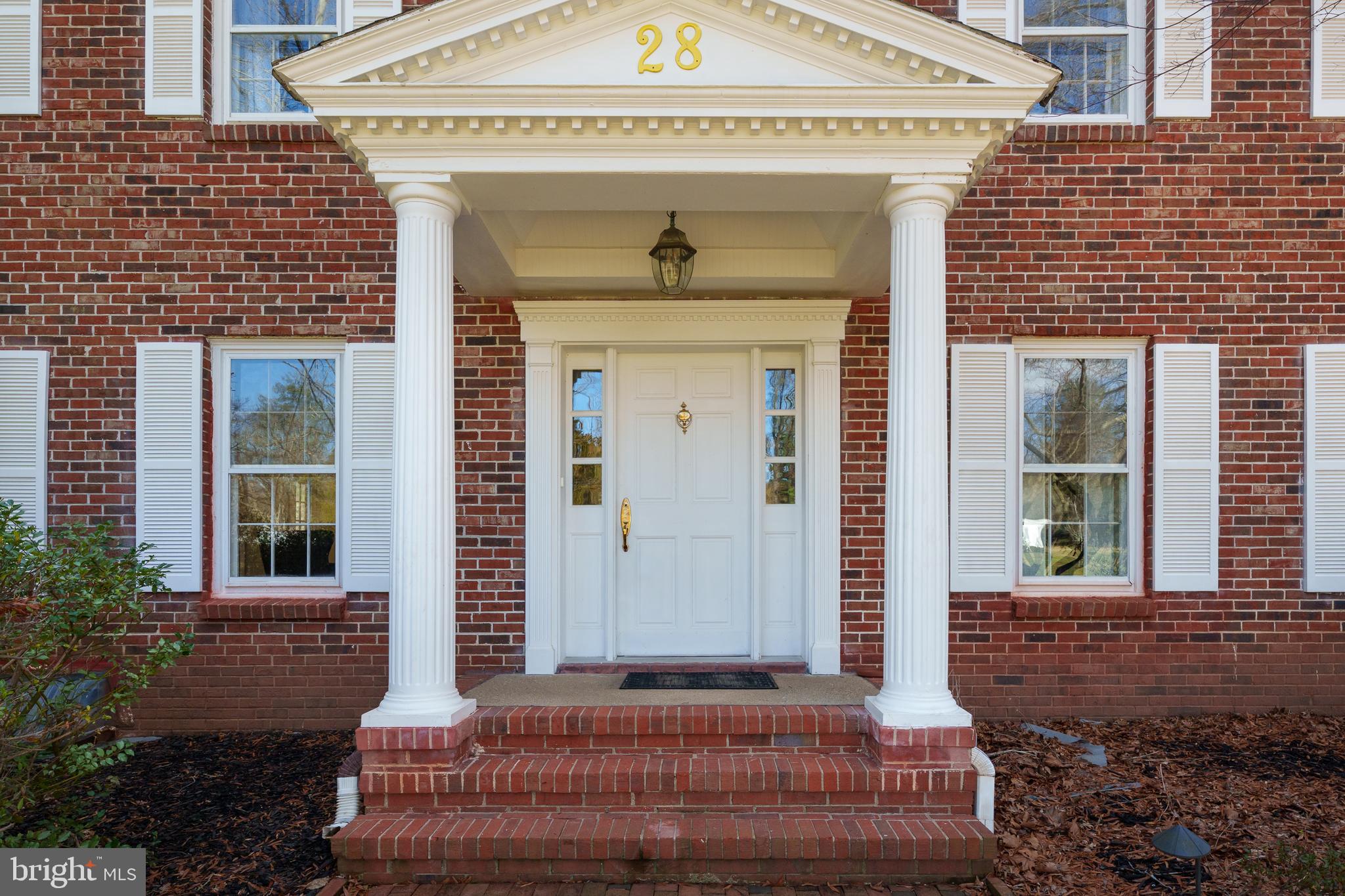 28 Talbot Lane Princeton, NJ 08540 - Photo 2 of 55 a front view of a house with a yard