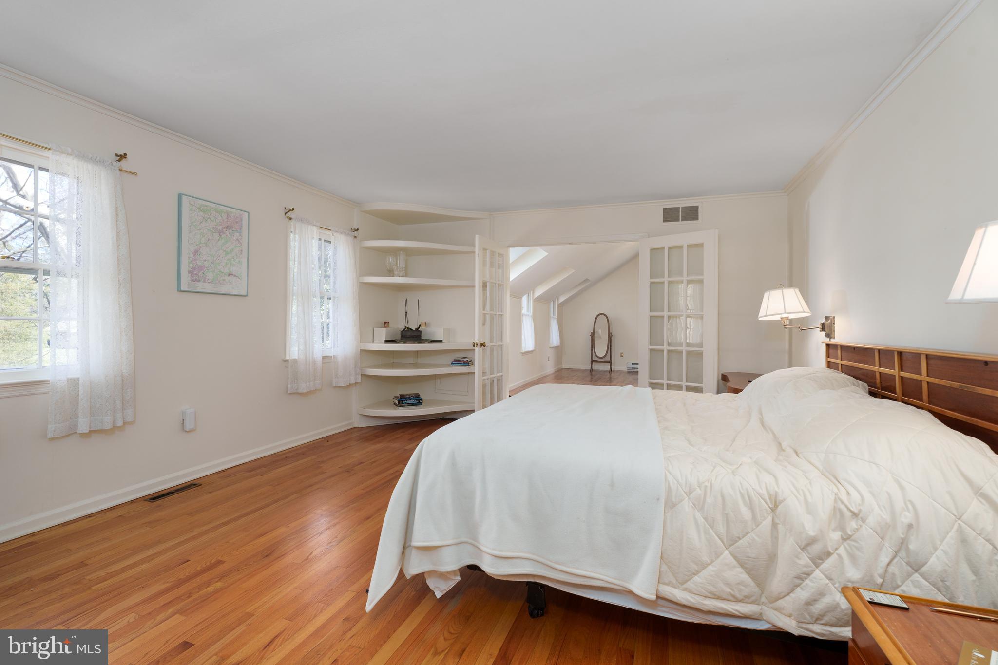 28 Talbot Lane Princeton, NJ 08540 - Photo 24 of 55 a bedroom with a bed and wooden floor