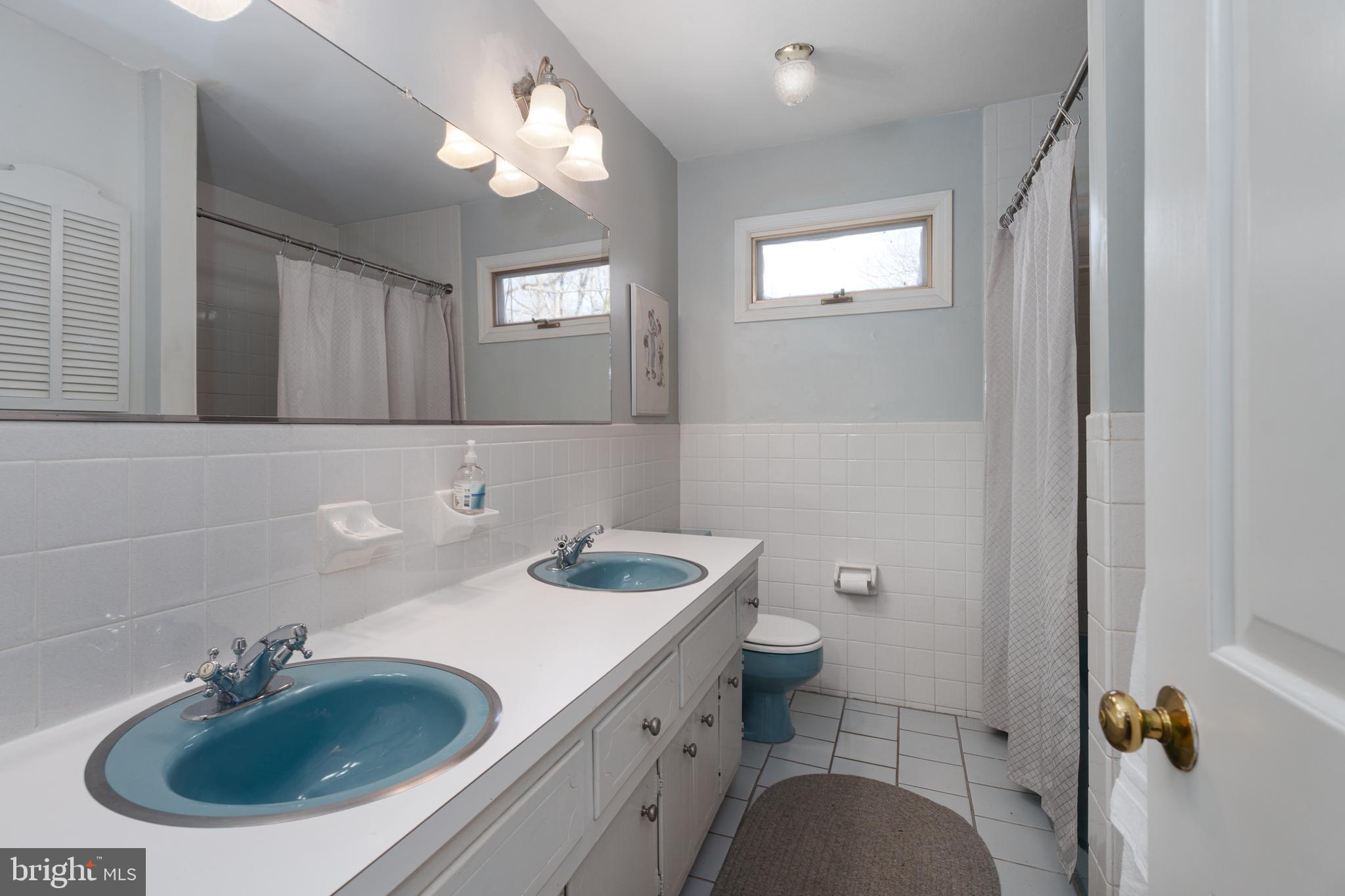 28 Talbot Lane Princeton, NJ 08540 - Photo 31 of 55 a bathroom with a sink a toilet and a mirror