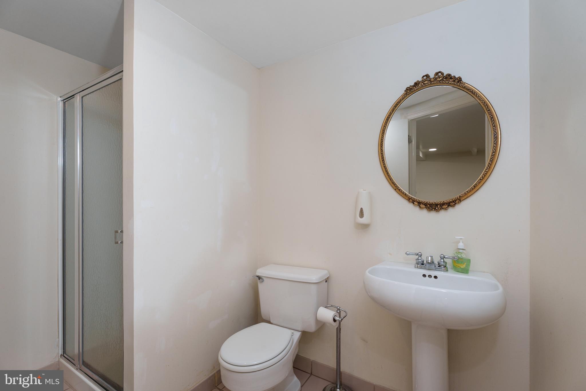 28 Talbot Lane Princeton, NJ 08540 - Photo 38 of 55 a bathroom with a toilet sink and mirror